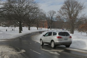 Cars have to cross lanes where snow is not cleared from the road. (Photo by Charlie Smart)