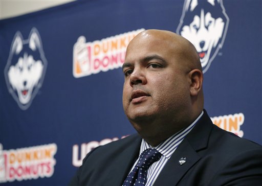 Former Connecticut athletic director Warde Manuel speaks during a news conference on campus in Storrs, Conn. in 2013 to introduce Bob Diaco as Connecticut's new head football coach. (AP Photo/Elise Amendola)